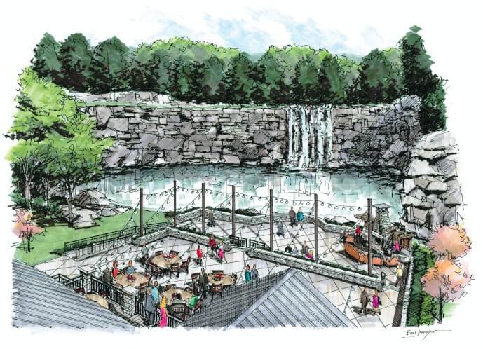 A picturesque outdoor dining area with tables and chairs overlooks a serene pond and waterfall in Williamson County, Tennessee.