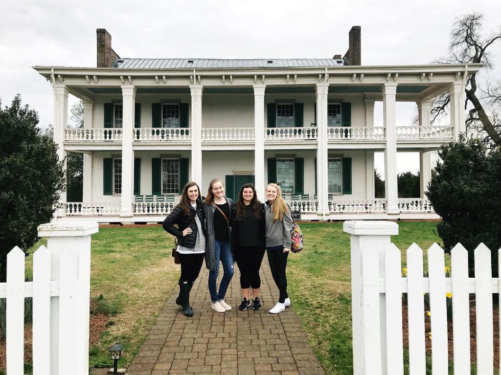 6 Facts You Didn't Know About Franklin (But Will Want to) Five women stand on a brick path in front of a large white two-story house with columns in Williamson County, Tennessee.
