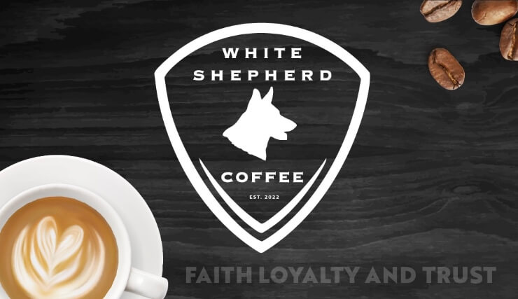White Shepherd Coffee logo featuring a dog silhouette on a shield with coffee beans and a latte in Williamson County, Tennessee.