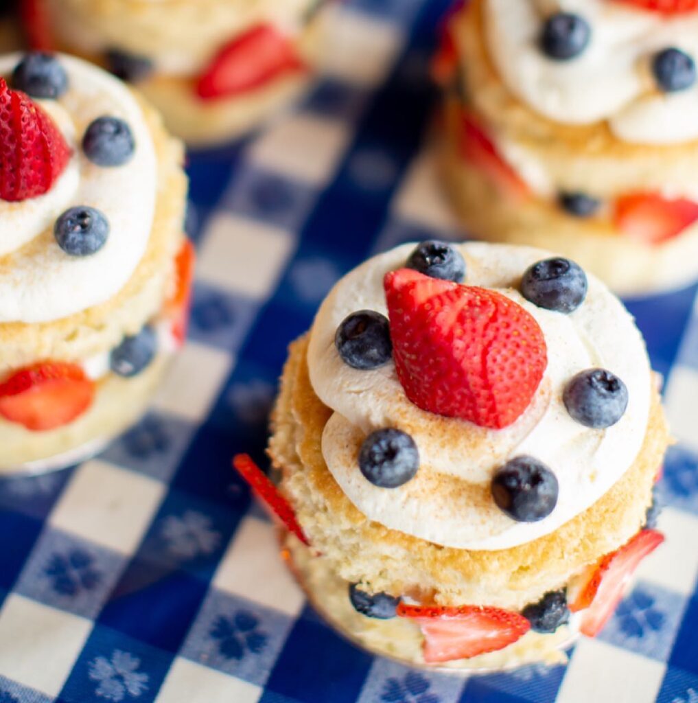 Mini strawberry shortcake cups topped with whipped cream, blueberries, and a strawberry in Williamson County, Tennessee.