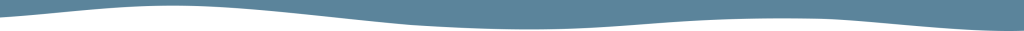 Two black triangular shapes resembling mountains or peaks against a light blue background in Williamson County, Tennessee.